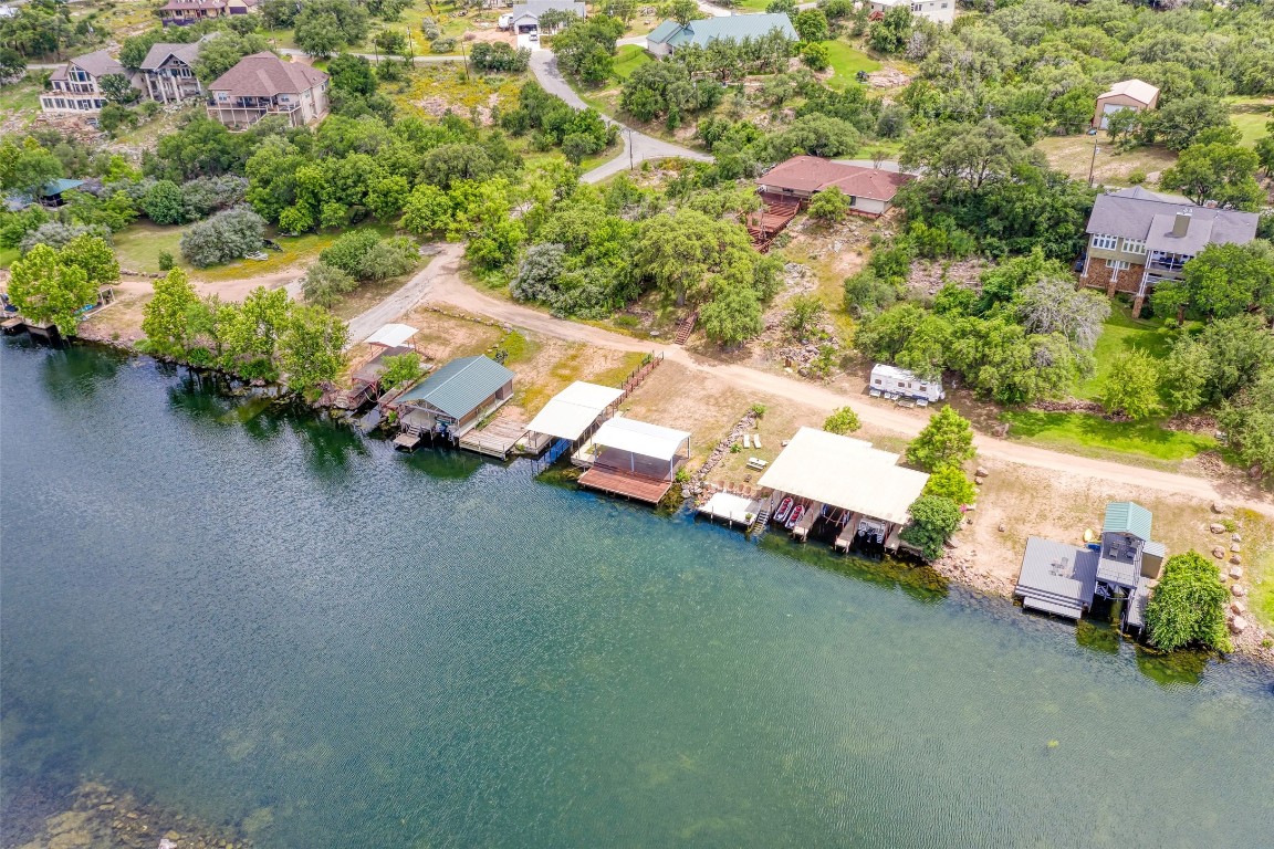 Aerial view showing entire property and the private dock and boat lift