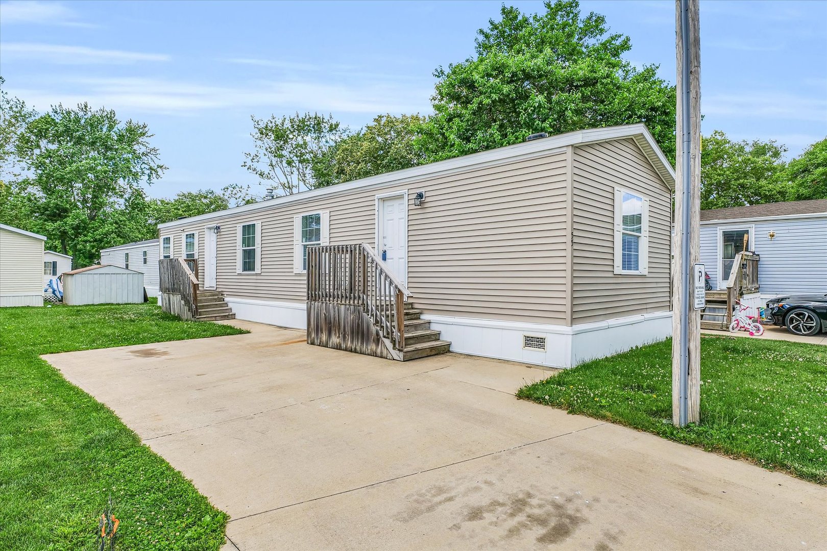 a view of a house with a yard and a garage