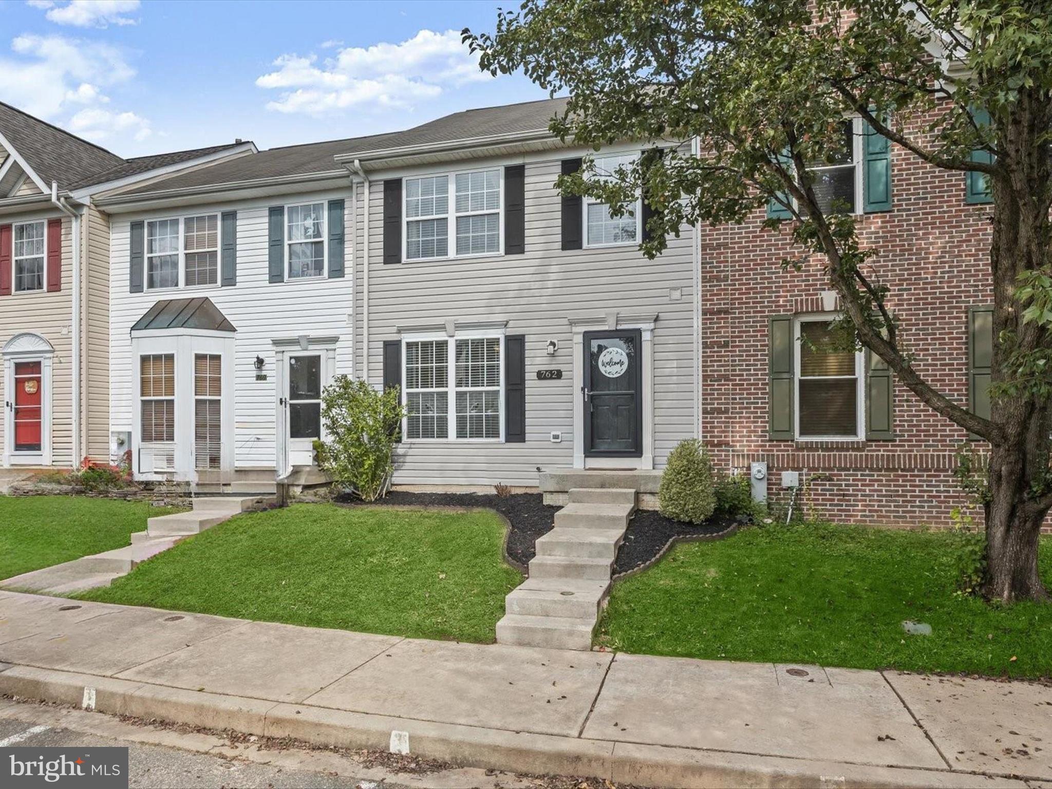 front view of a house with a yard