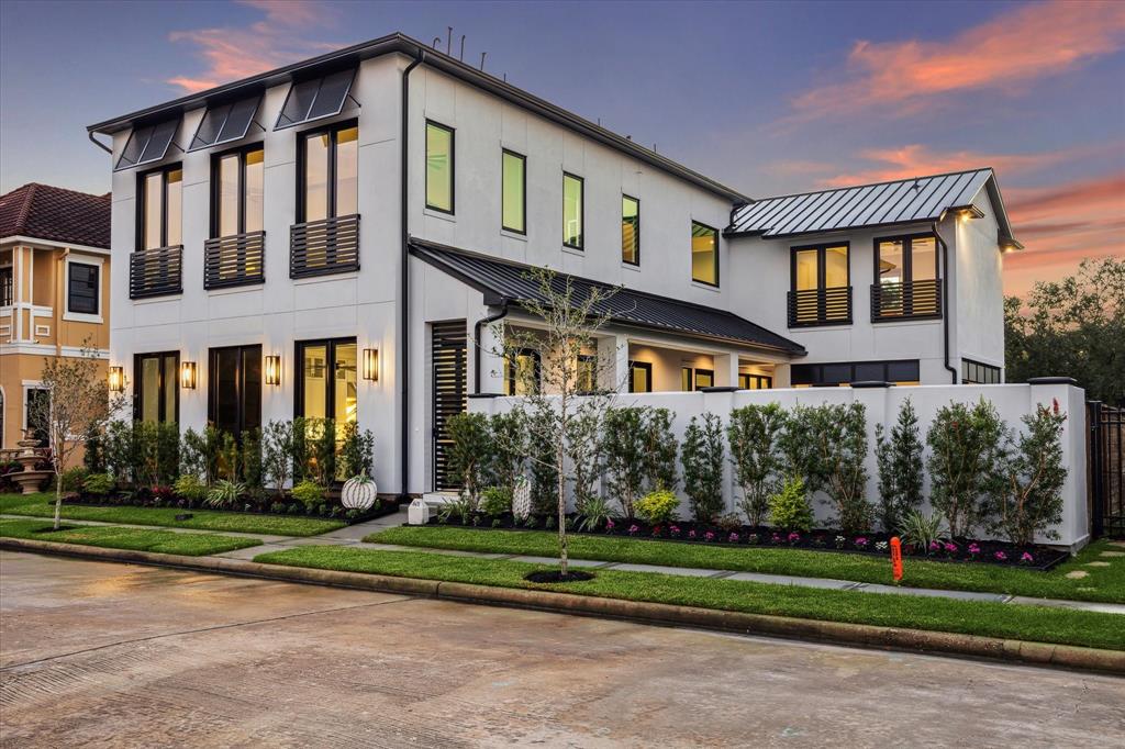 a front view of building with yard and green space