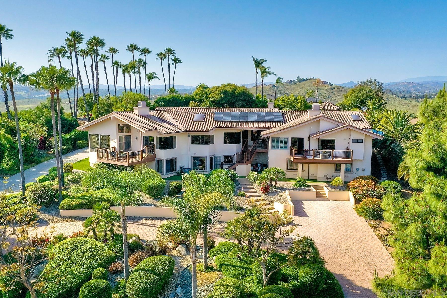 a aerial view of a house with garden and plants