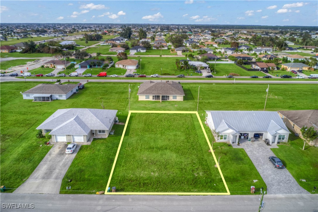 an aerial view of a house with a garden