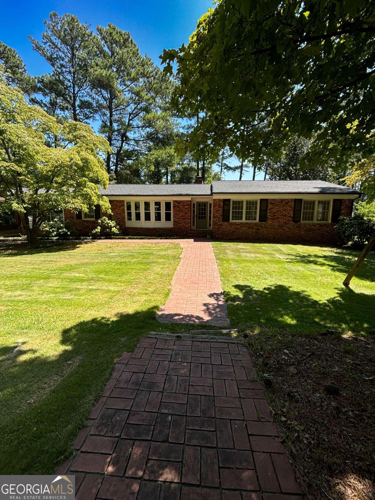 a view of a house with swimming pool