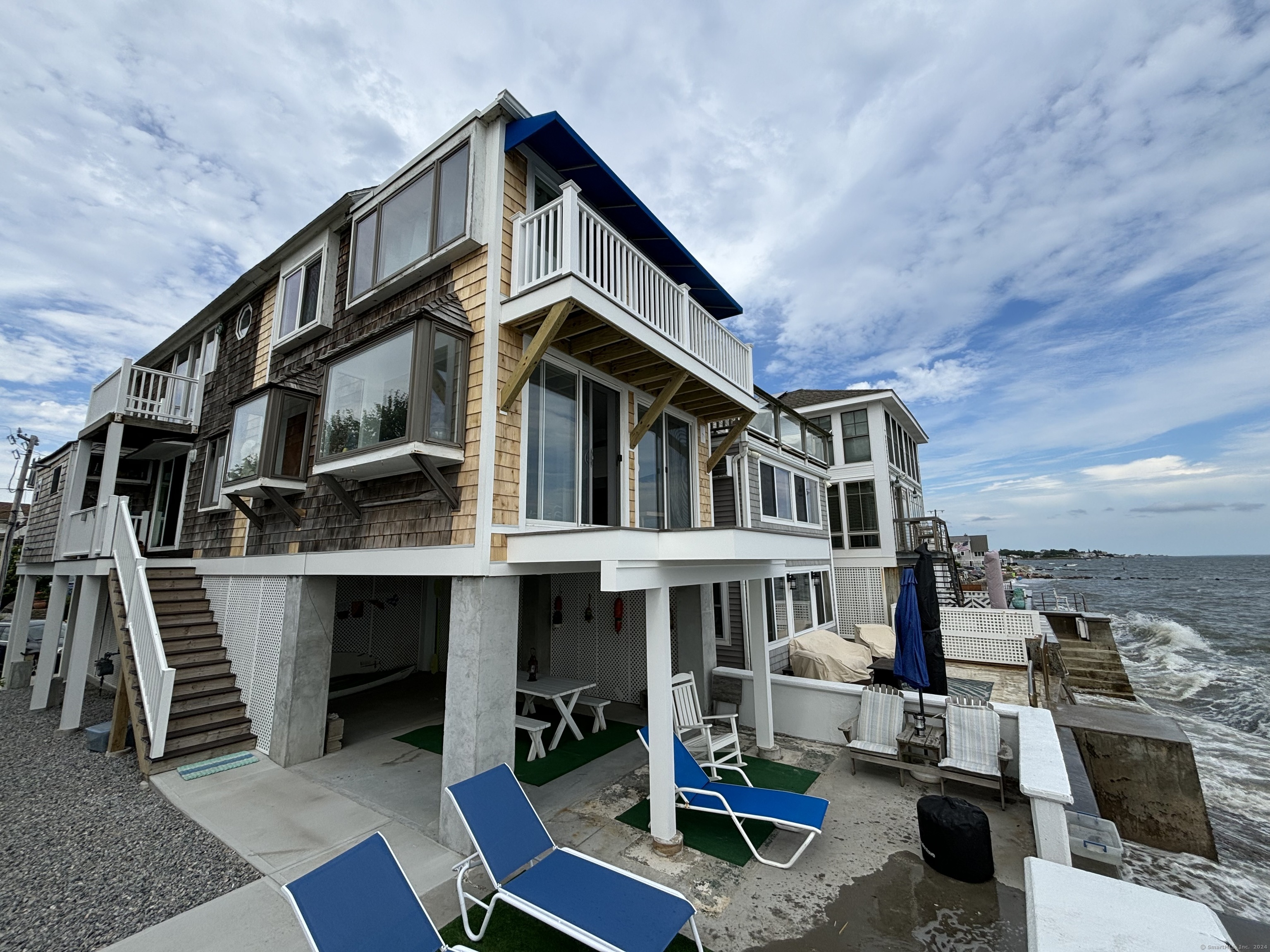 a front view of a house with parking area