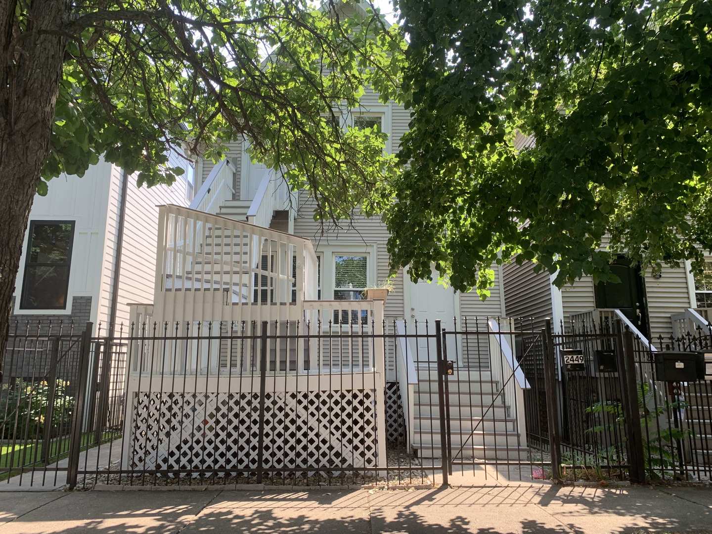 a view of a wrought iron fences in front of house