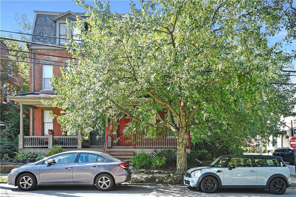 front view of a car parked in front of a house