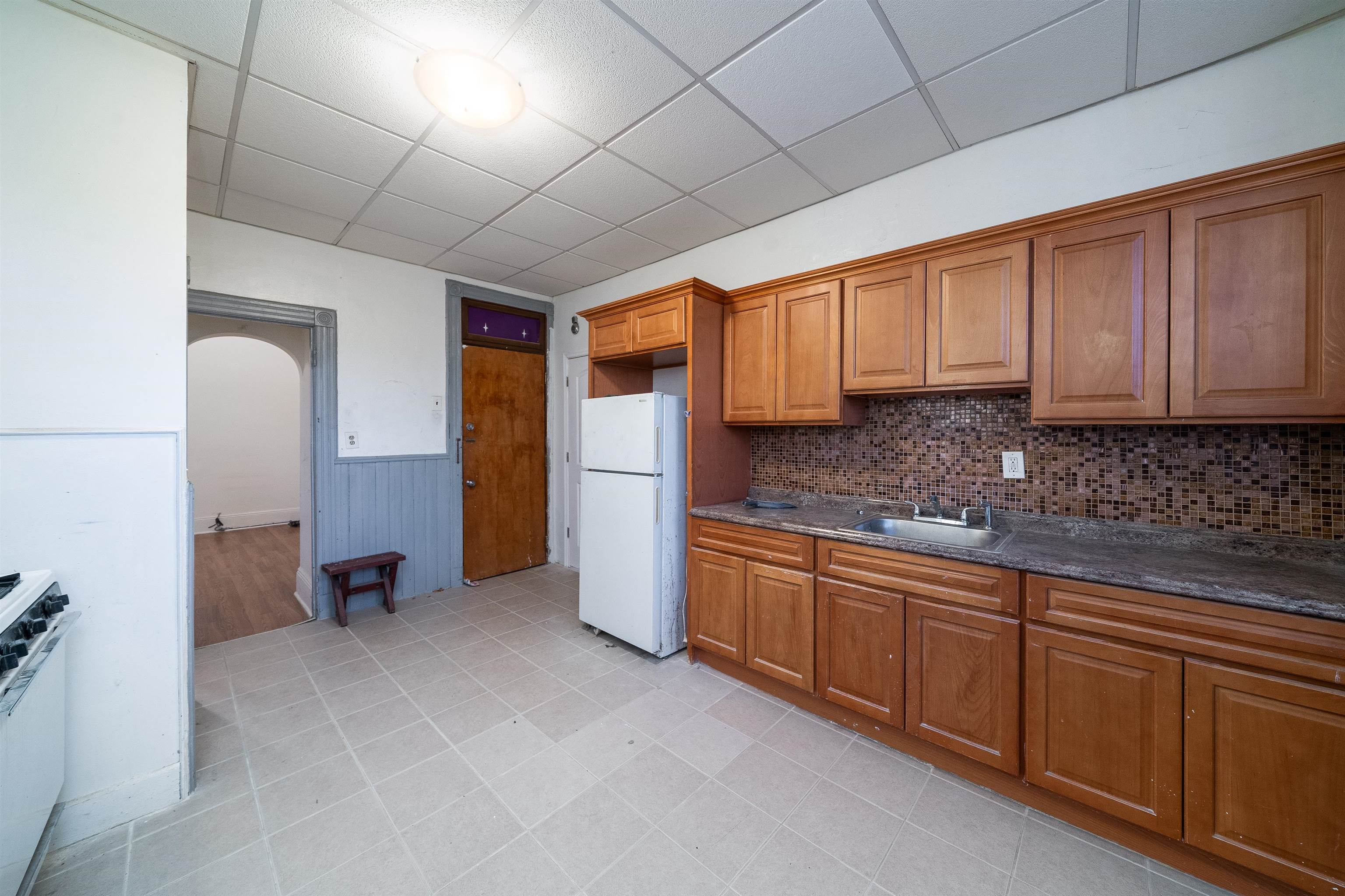 a kitchen with stainless steel appliances granite countertop a sink and cabinets