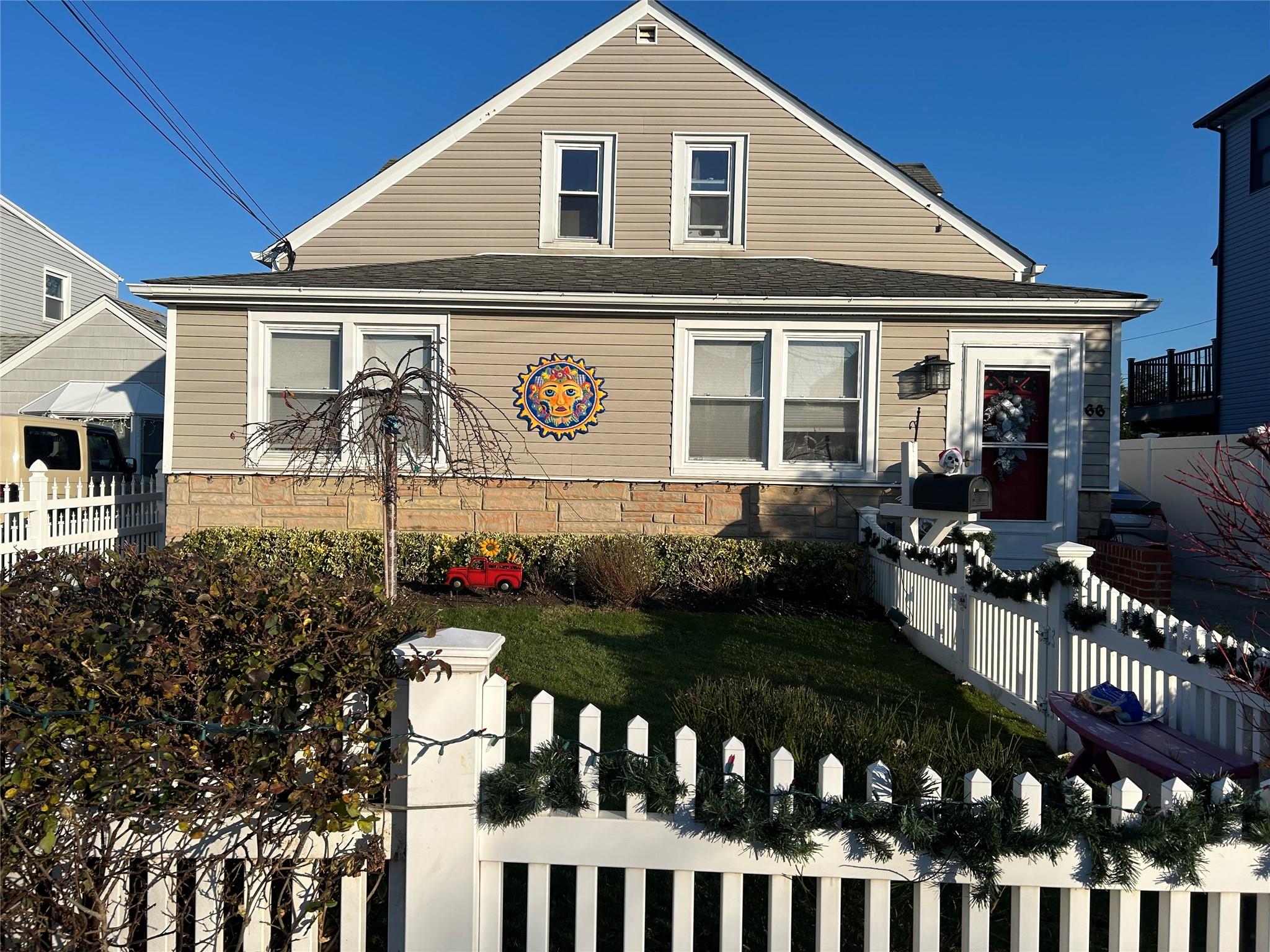 a front view of house and yard with seating space