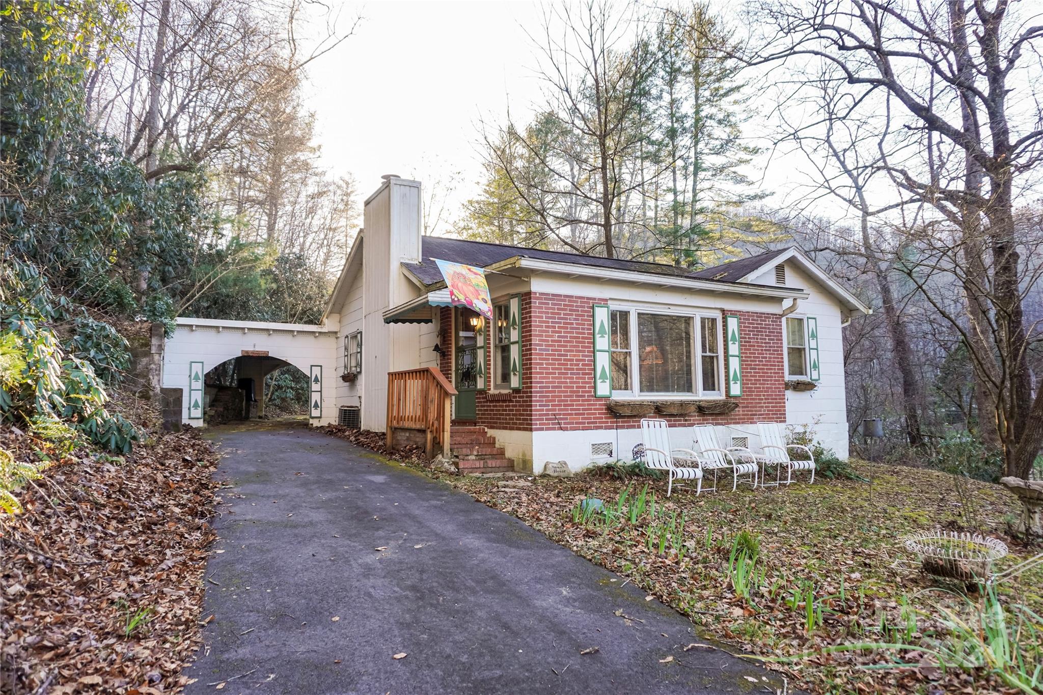 a front view of a house with yard and garage