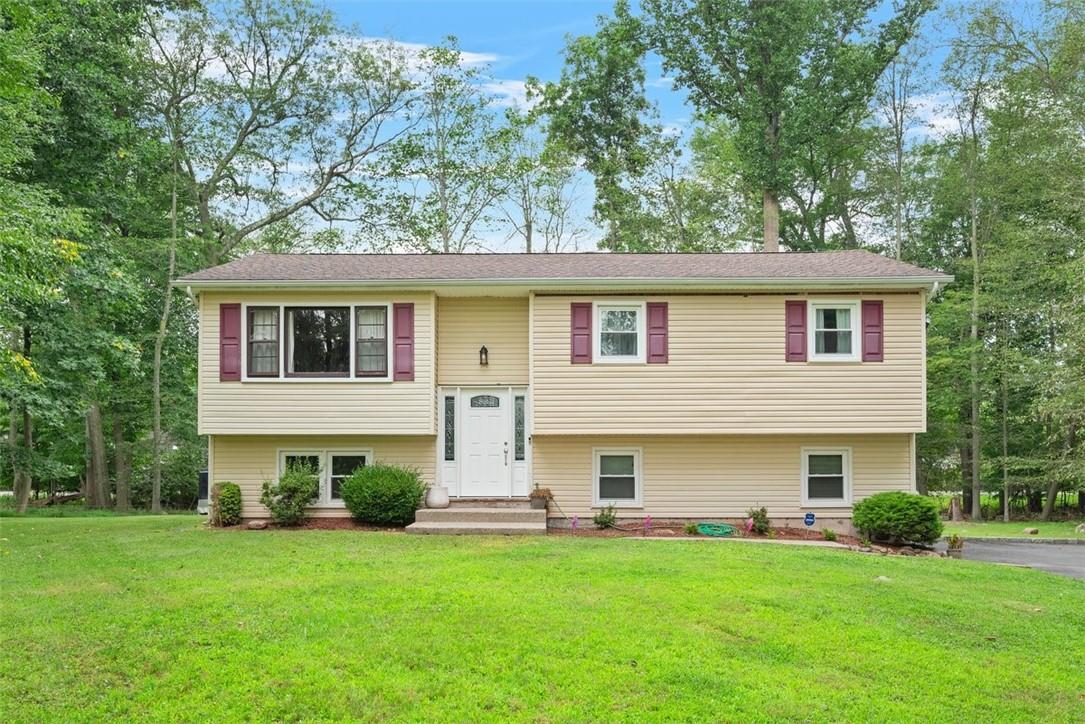 Raised ranch with a front lawn