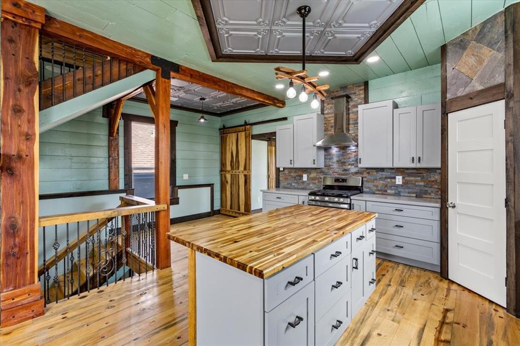 a kitchen that has a lot of cabinets in it