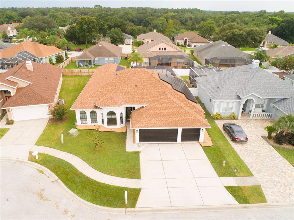 an aerial view of a house with swimming pool