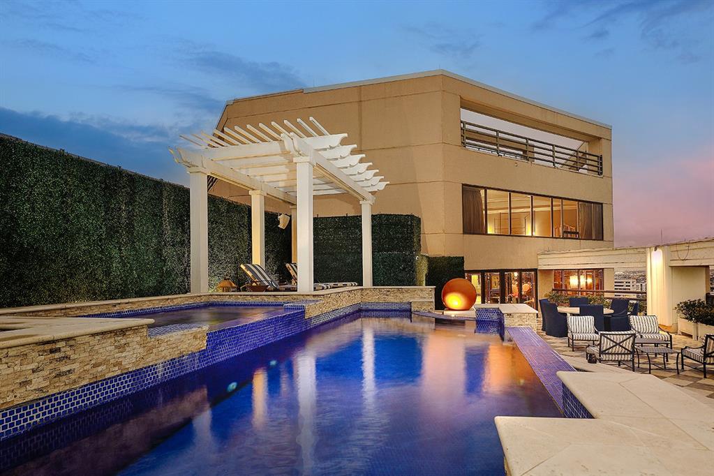 a view of swimming pool with outdoor seating