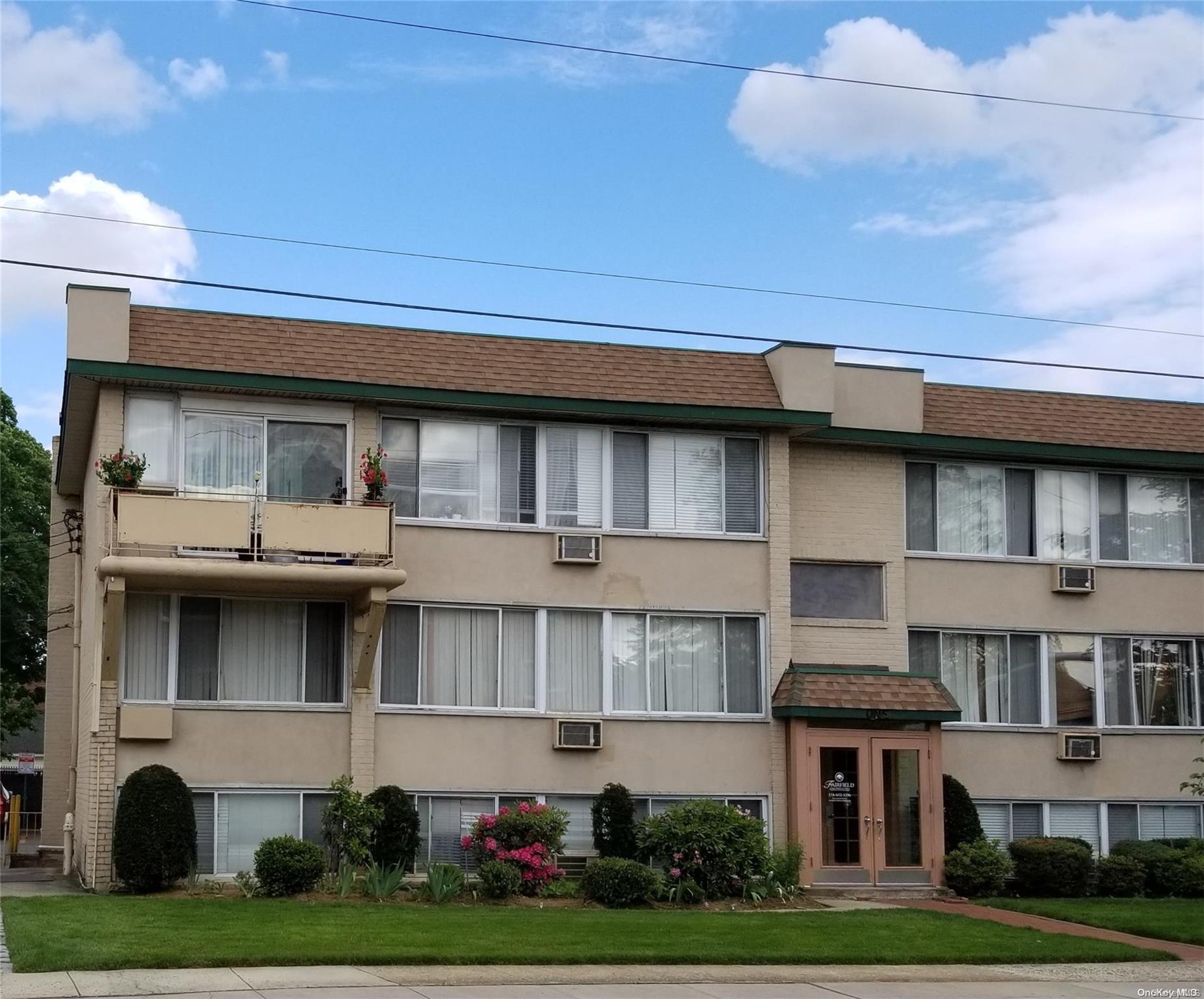 a view of building with yard