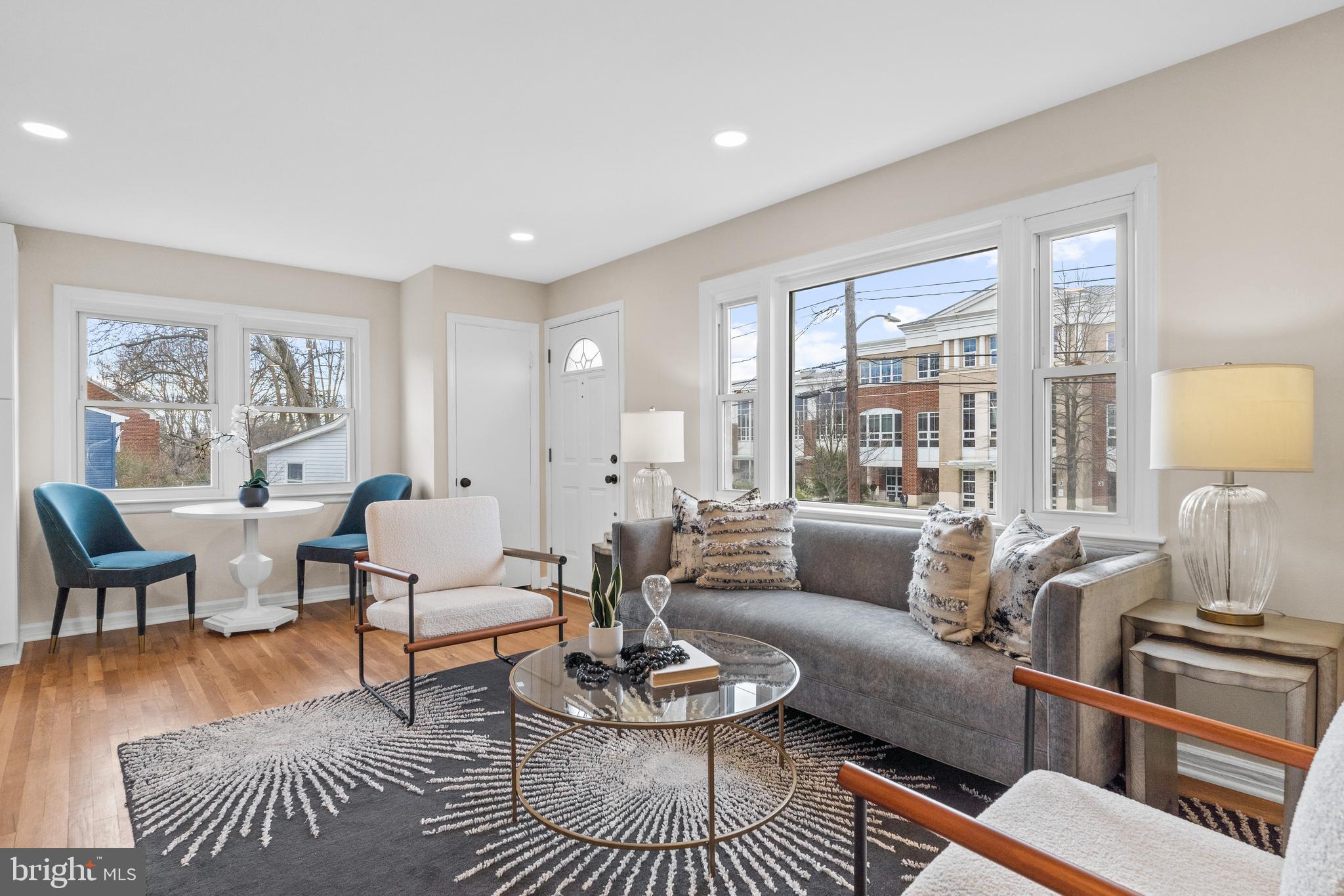 a living room with furniture or couch and a lamp