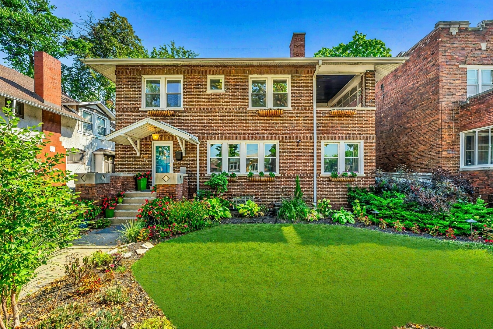 front view of a house with a yard