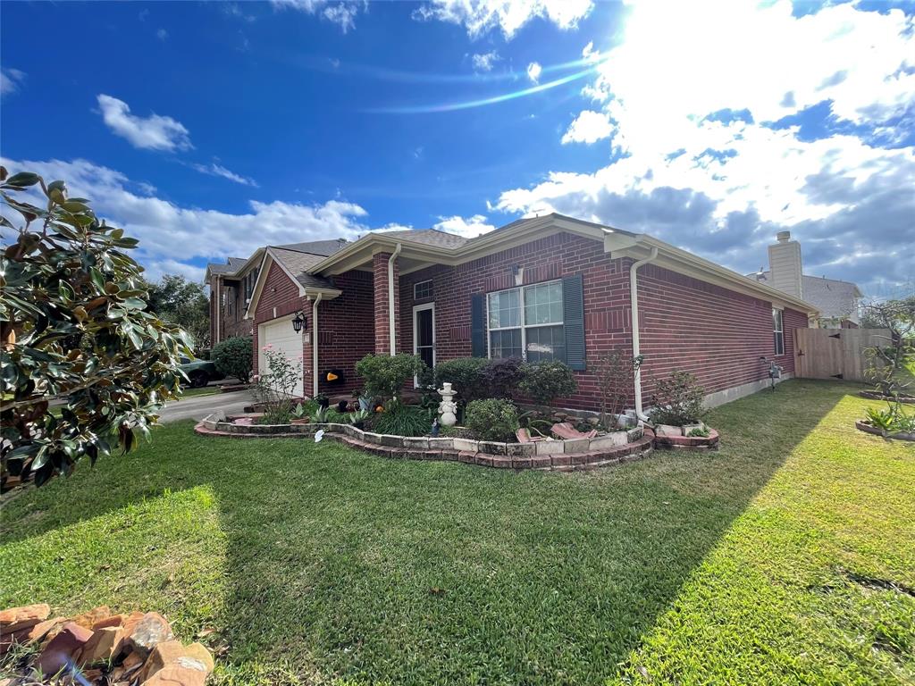 Beautiful landscaped yard on Corner lot.