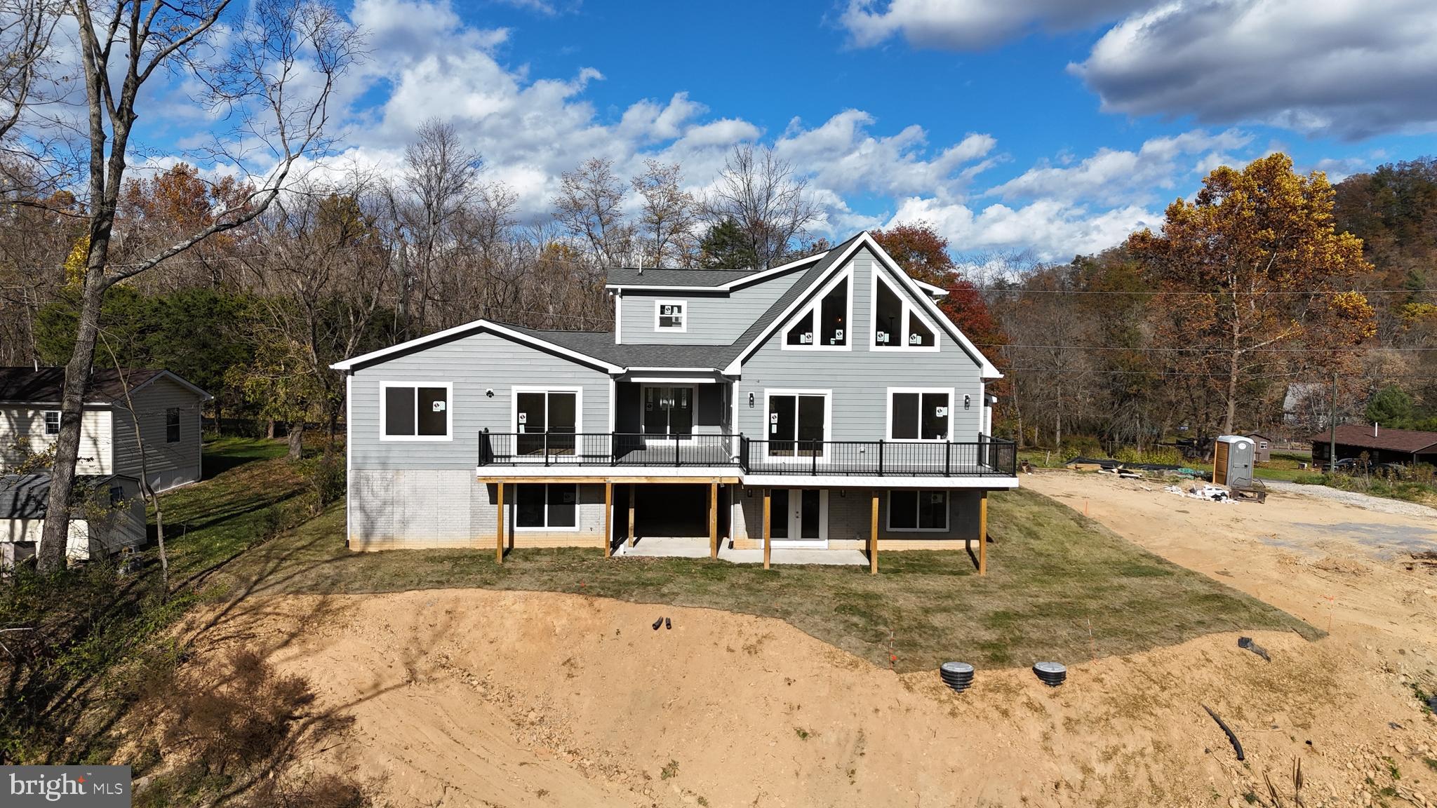 a front view of a house with a big yard