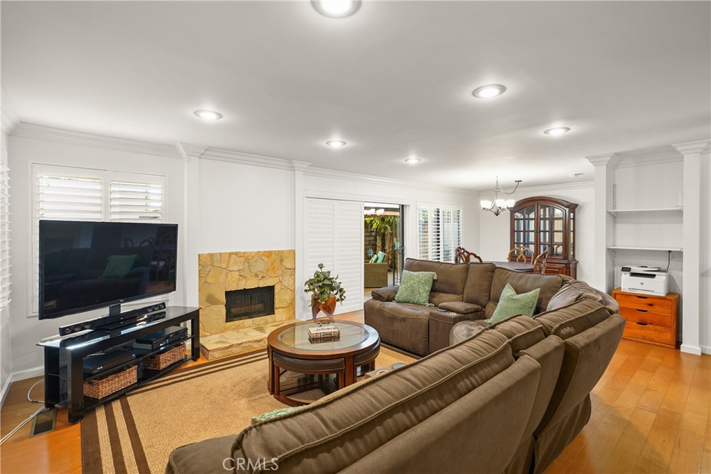 Stone faced fireplace, freshly painted and wood flooring, too