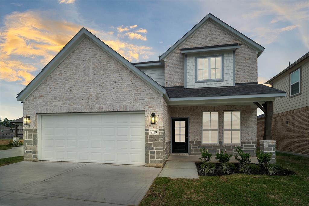 Welcome home to 2129 Reed Cave Lane located in Forest Village and zoned to Conroe ISD.