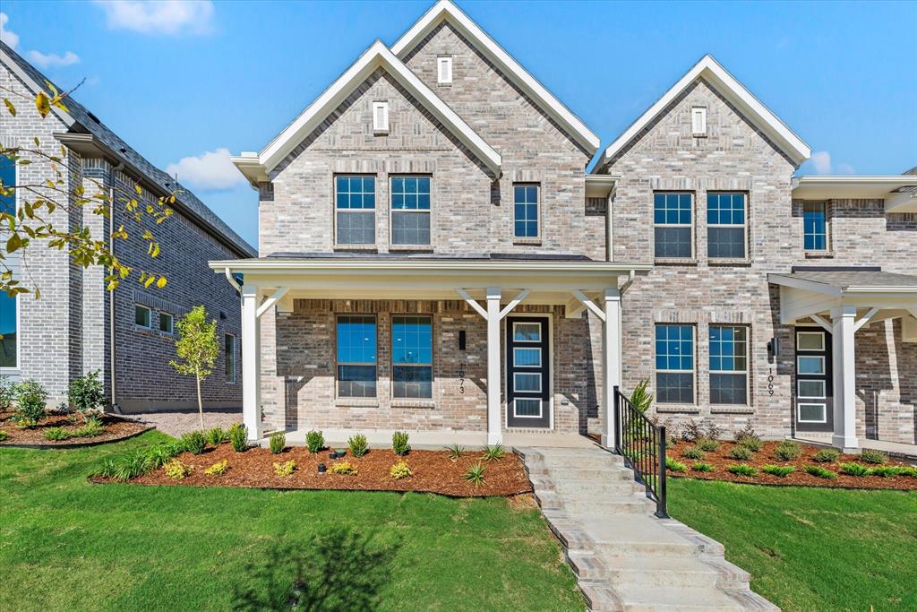 front view of a house with a yard