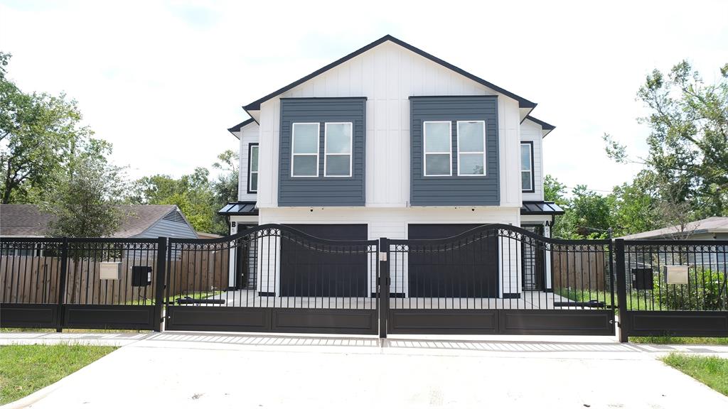 a front view of a house with a fence