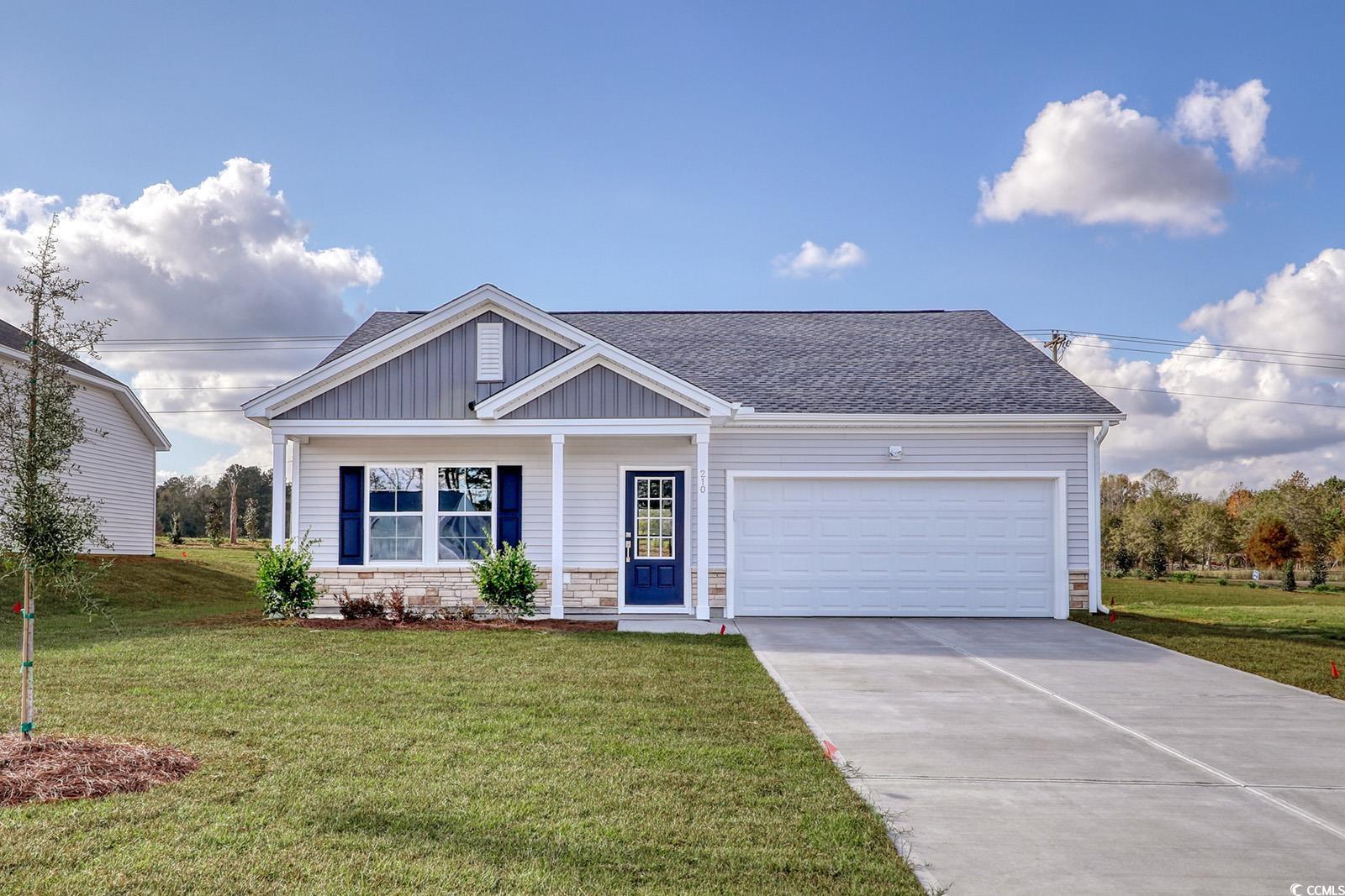 View of front of house featuring a garage and a fr