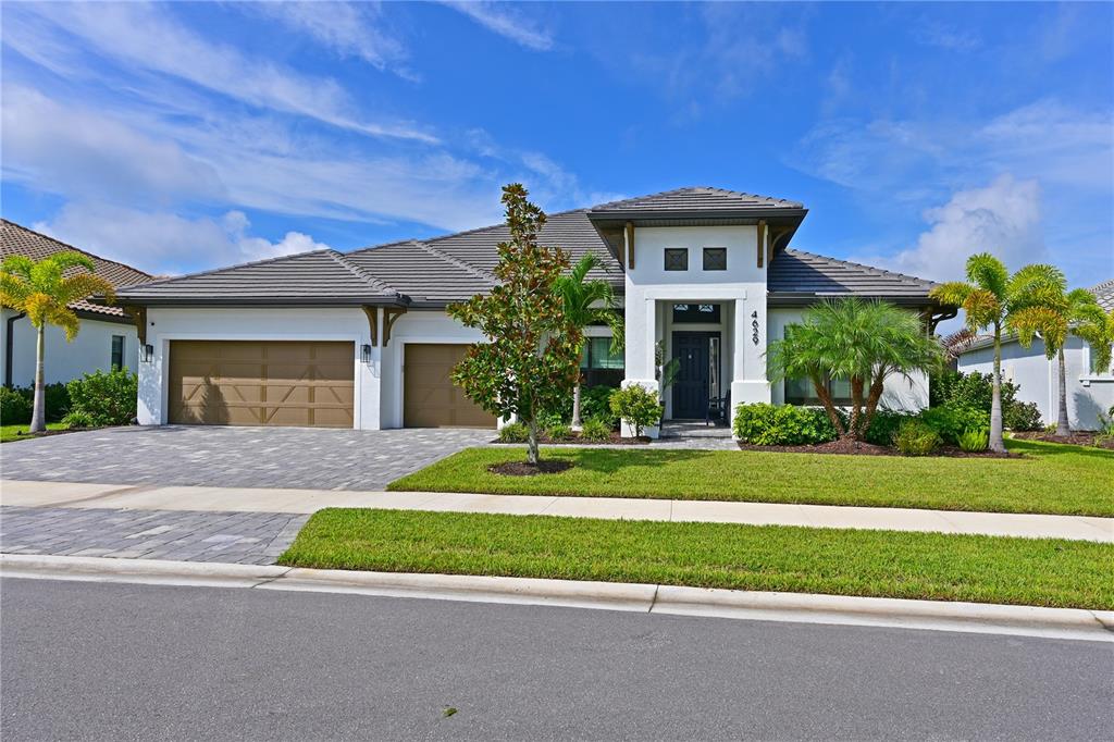 a front view of a house with a yard