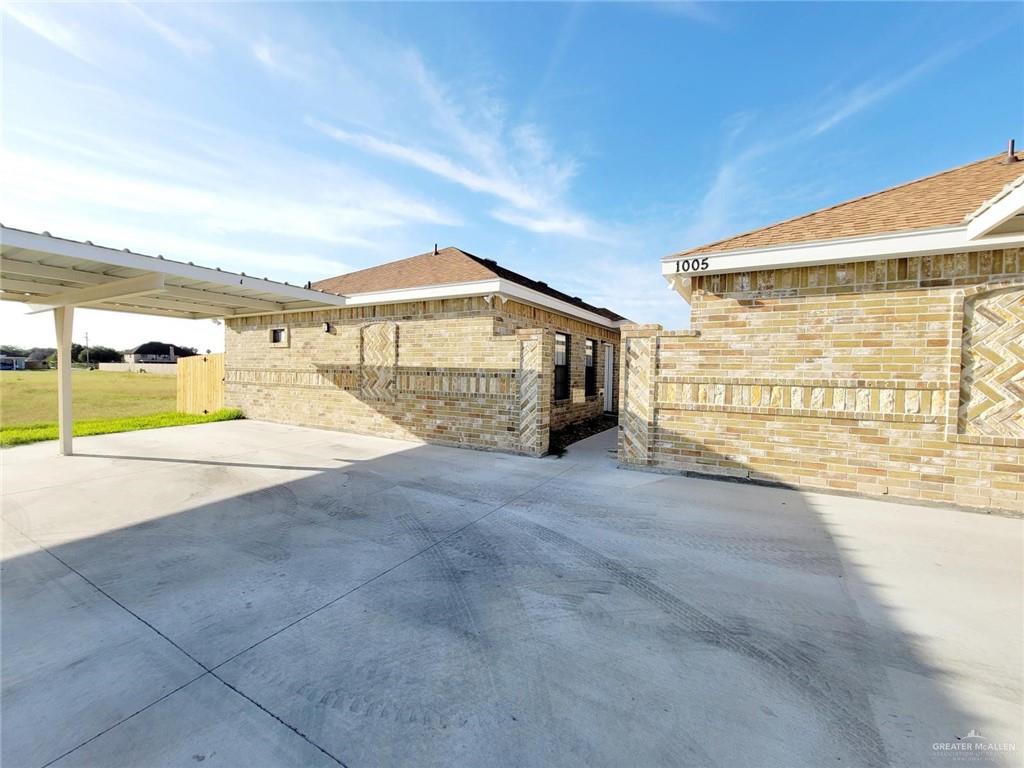 View of patio / terrace featuring a carport