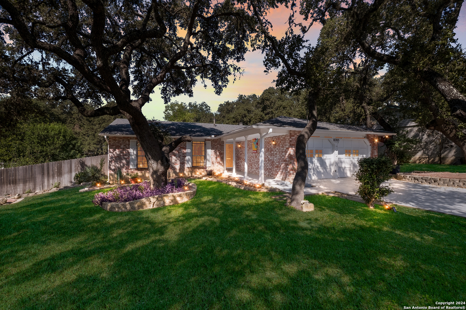 a view of a house with backyard and porch