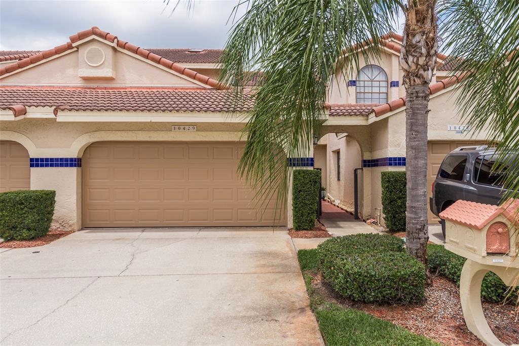 a front view of a house with a garage