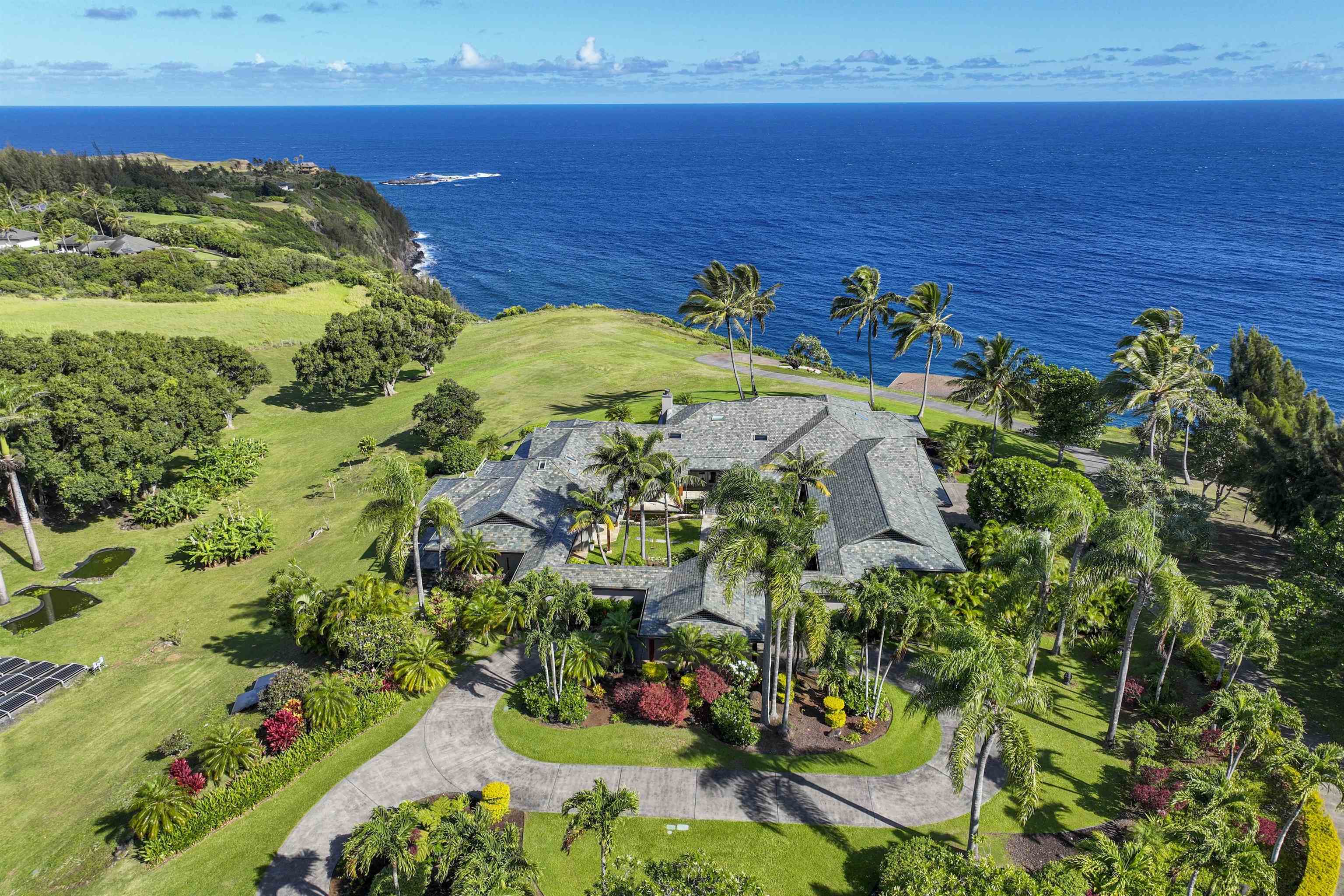 a view of a yard with an ocean 