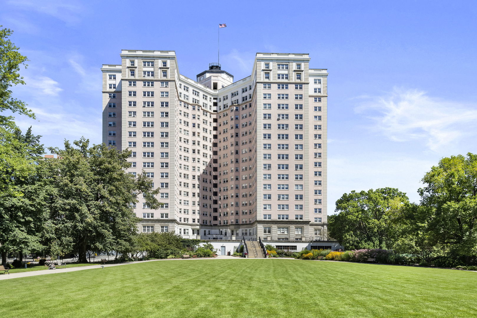 a view of a building with a yard