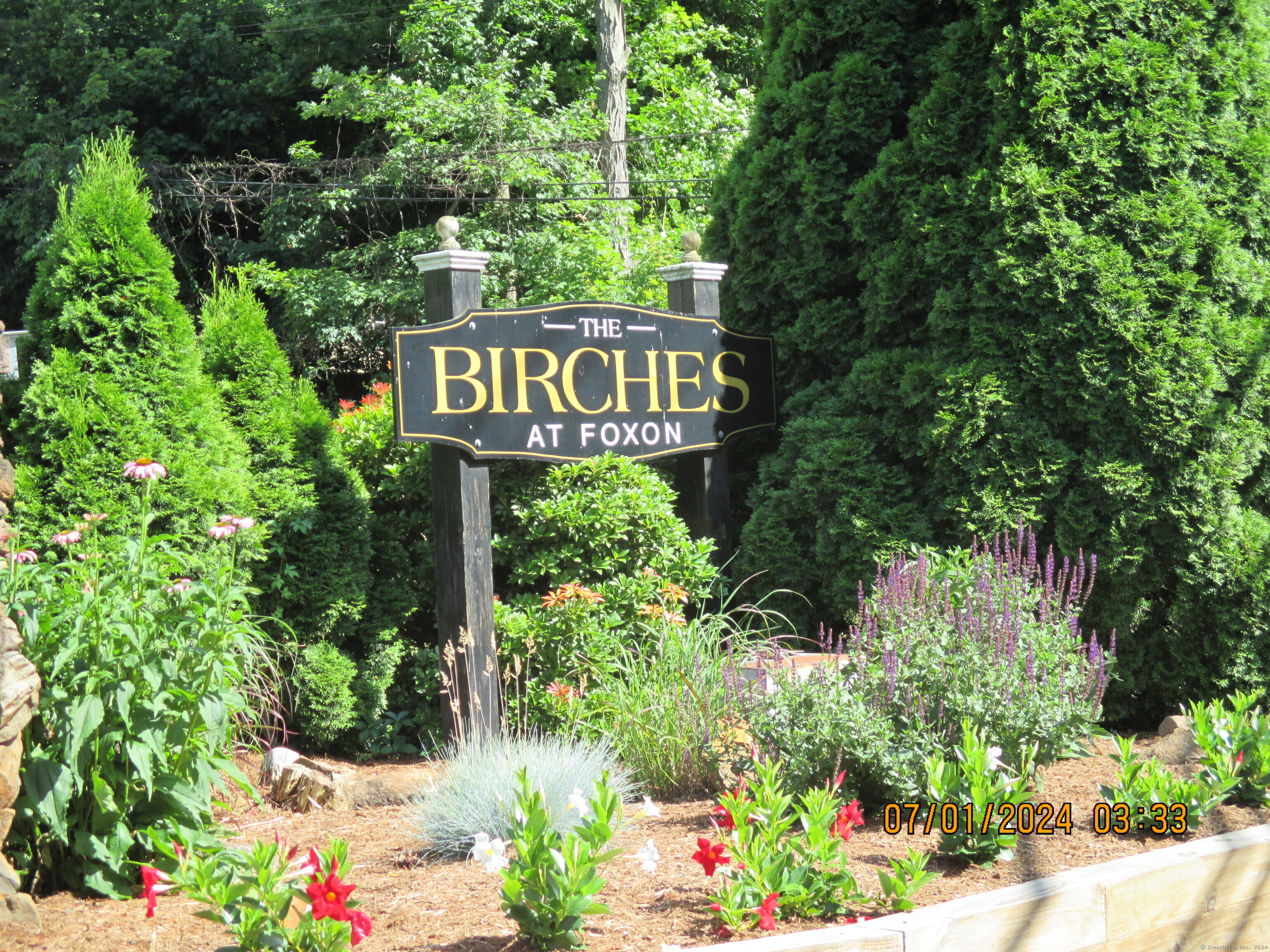 a view of sign board and green space