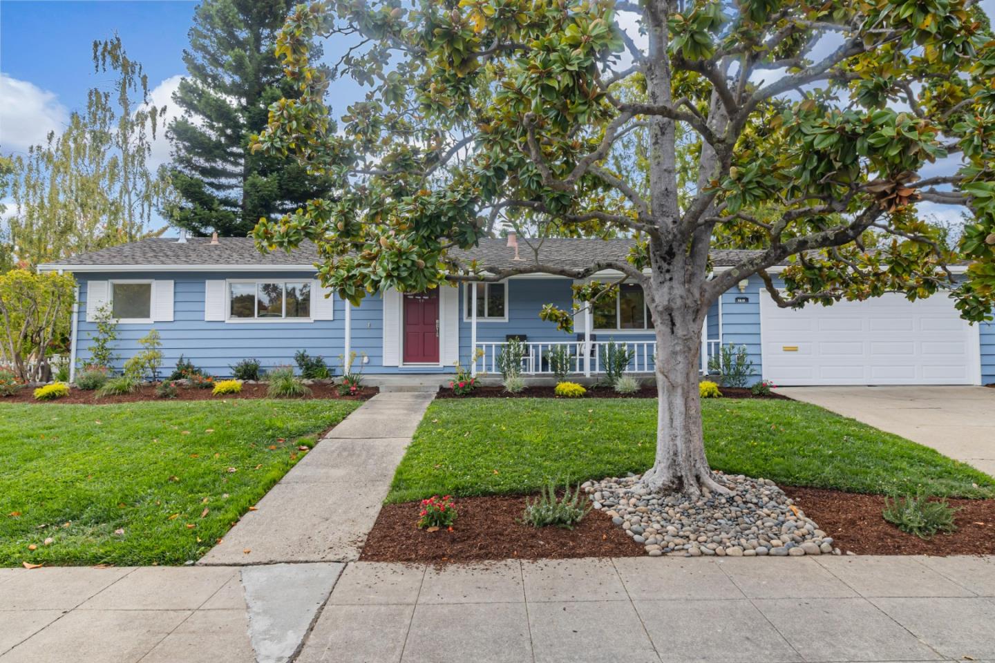 a front view of a house with a yard