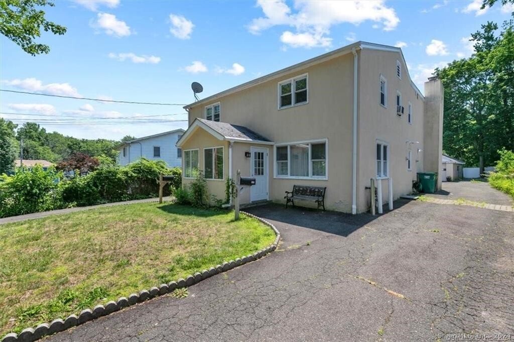 a front view of a house with a yard