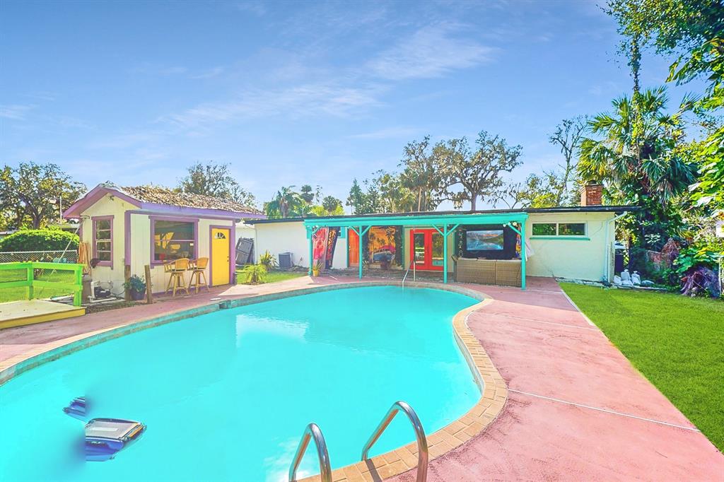 swimming pool view with seating space