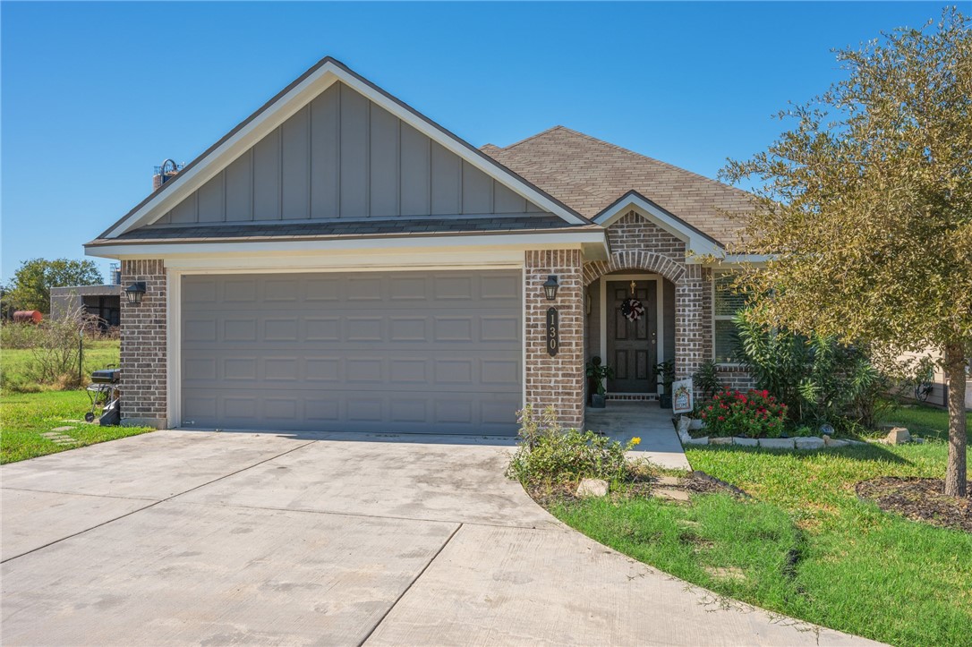 View of front facade featuring a garage