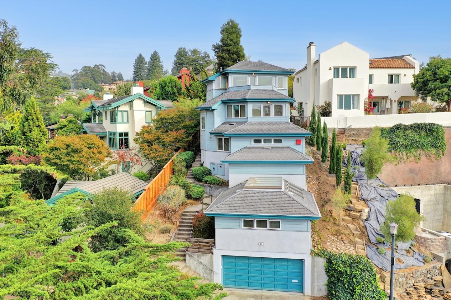 an aerial view of a residential apartment building with a yard