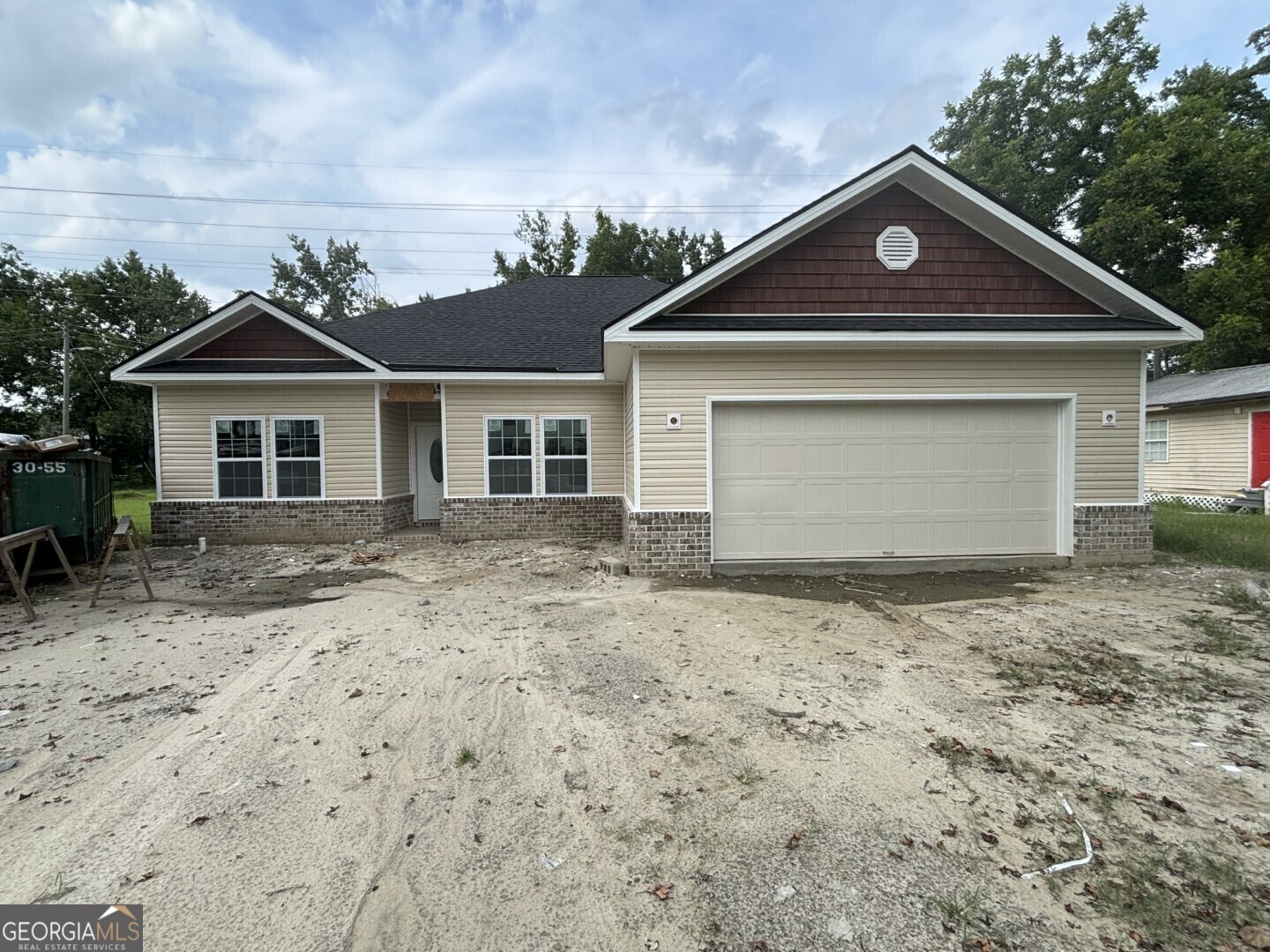 a front view of a house with a yard