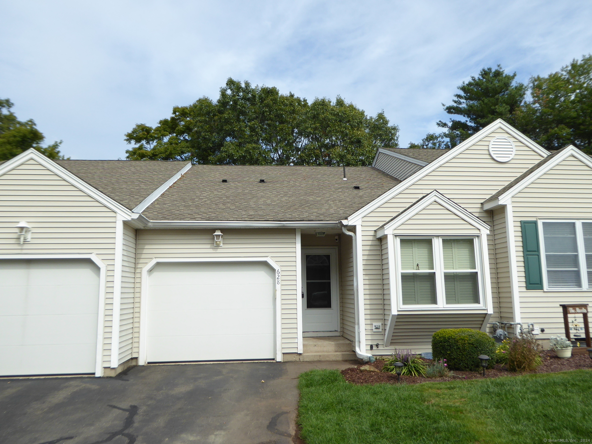 front view of a house and a yard