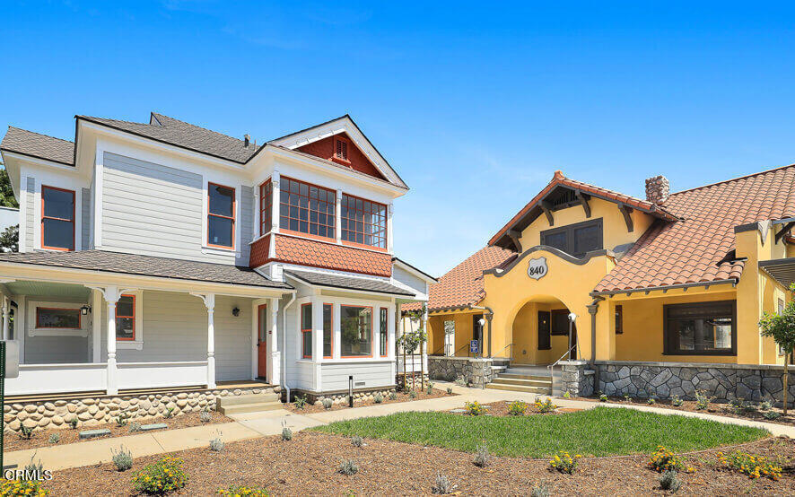 a front view of a house with garden