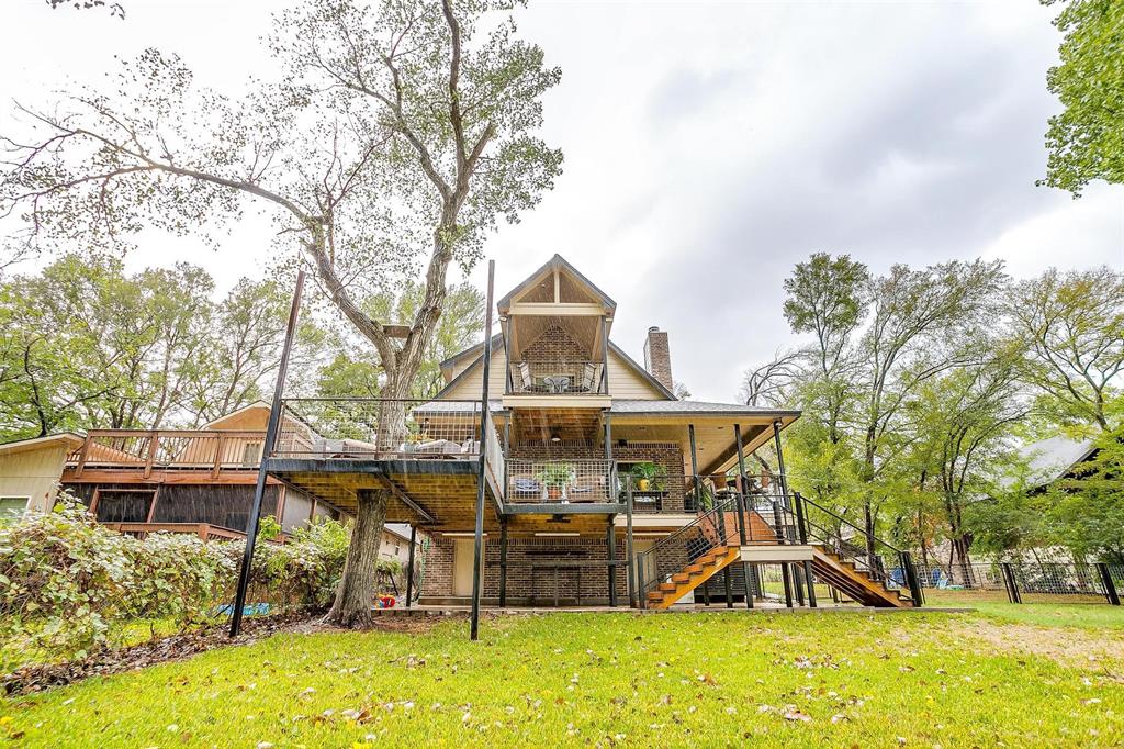 a view of a house with a yard patio and slide