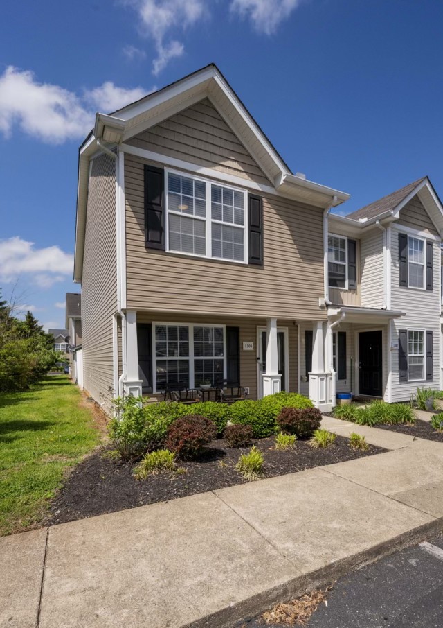 a front view of a house with a yard