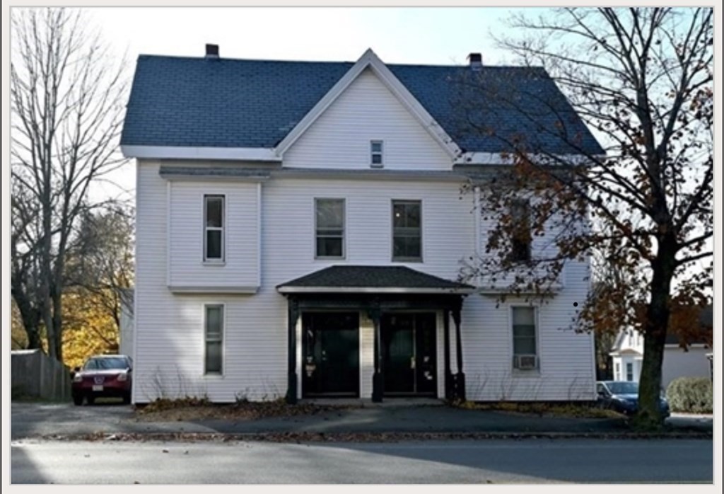 a front view of a house with yard