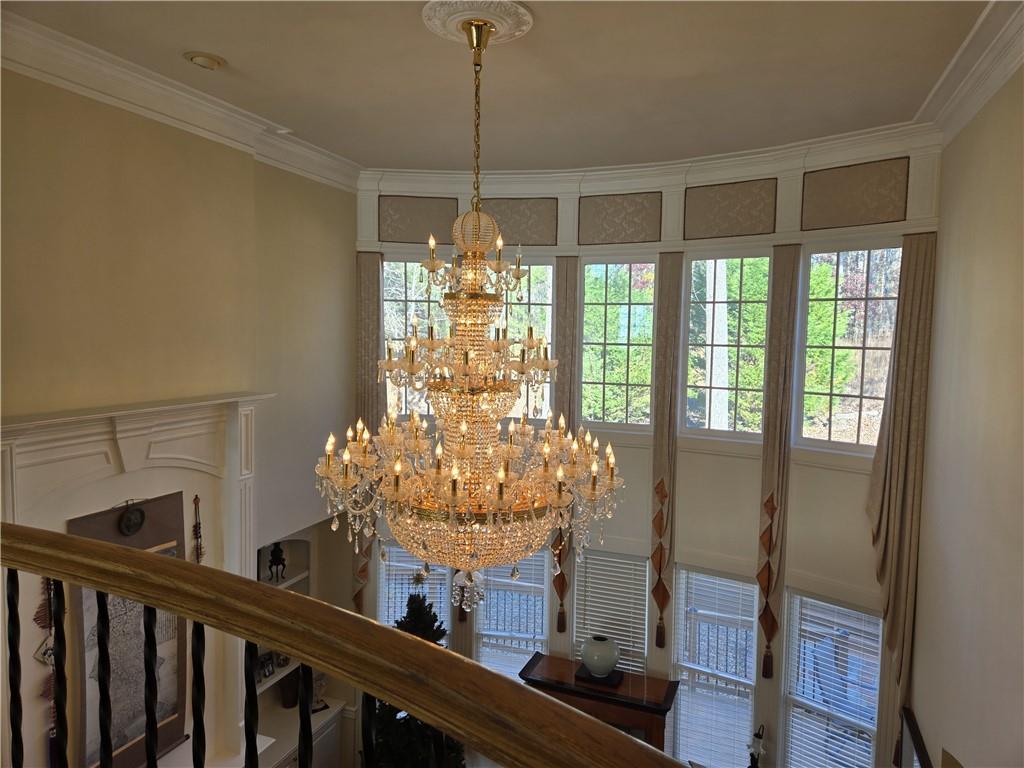 a view of a dining room with furniture and chandelier