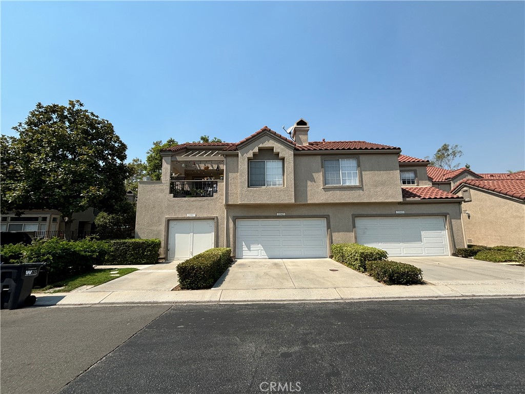 a view of a house with a street