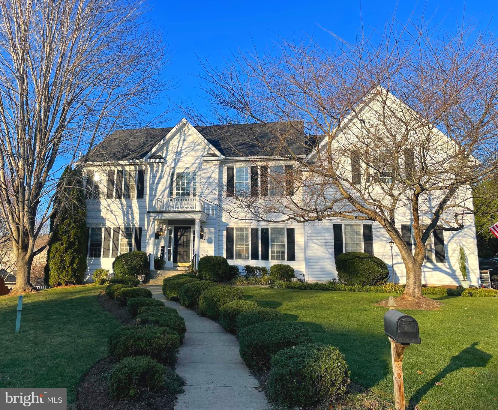 a view of house with a yard