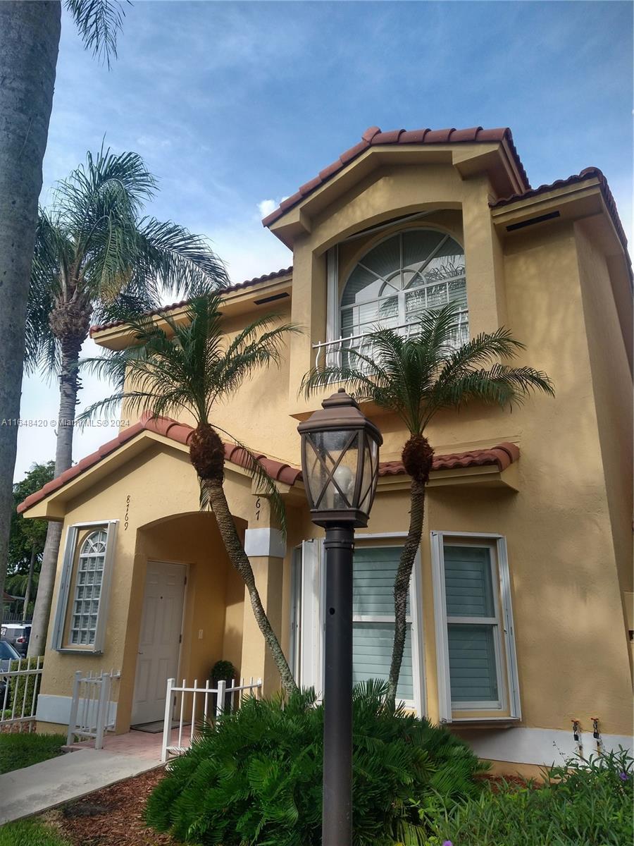 a front view of a house with a yard