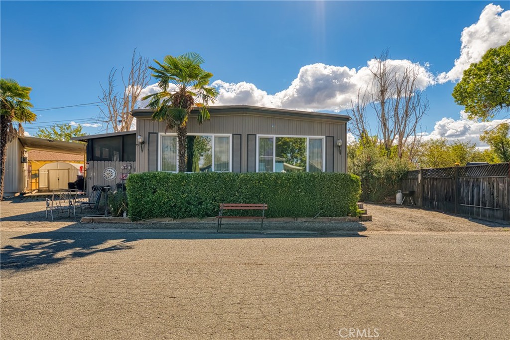 a front view of a house with a yard and a garage